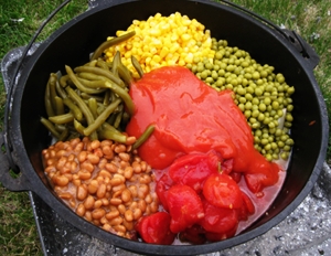 Dutch Oven Cowboy Stew with beans, corn, peas, tomatoes