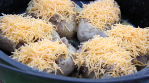 Sprinkle Cheese on the Top of Each Potato Boat