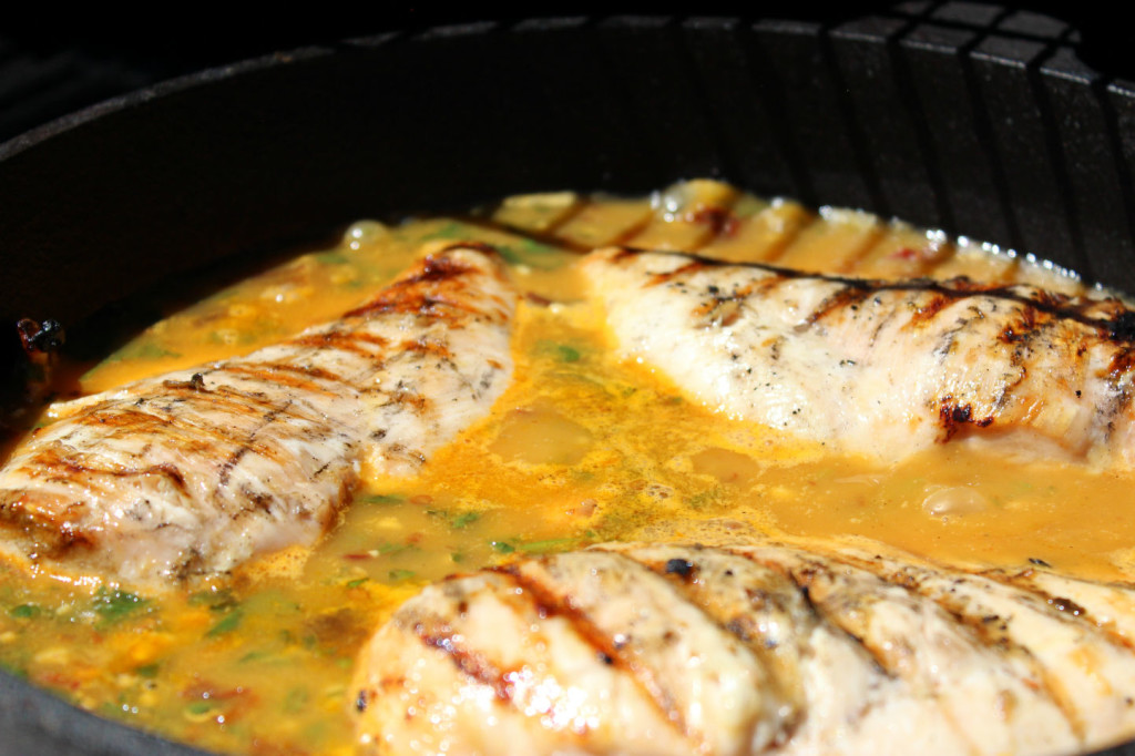 Chicken simmering in the Chipotle Orange Chicken Broth