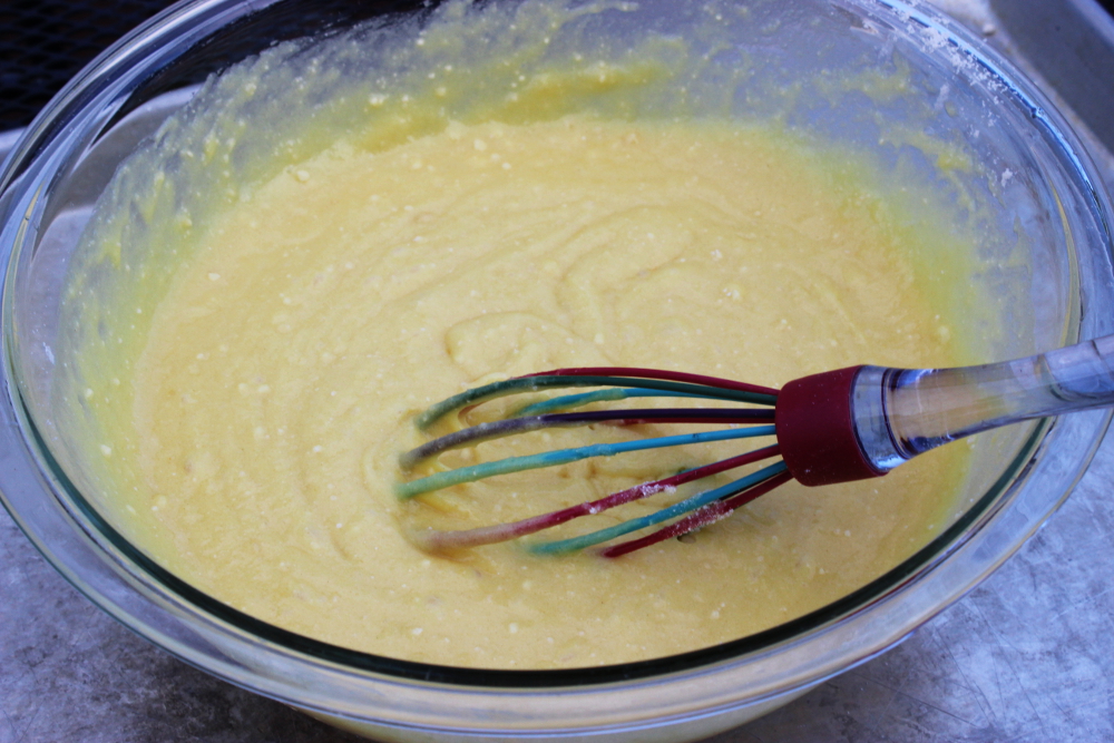 Mixing the cake mix, eggs, pineapple juice, and oil